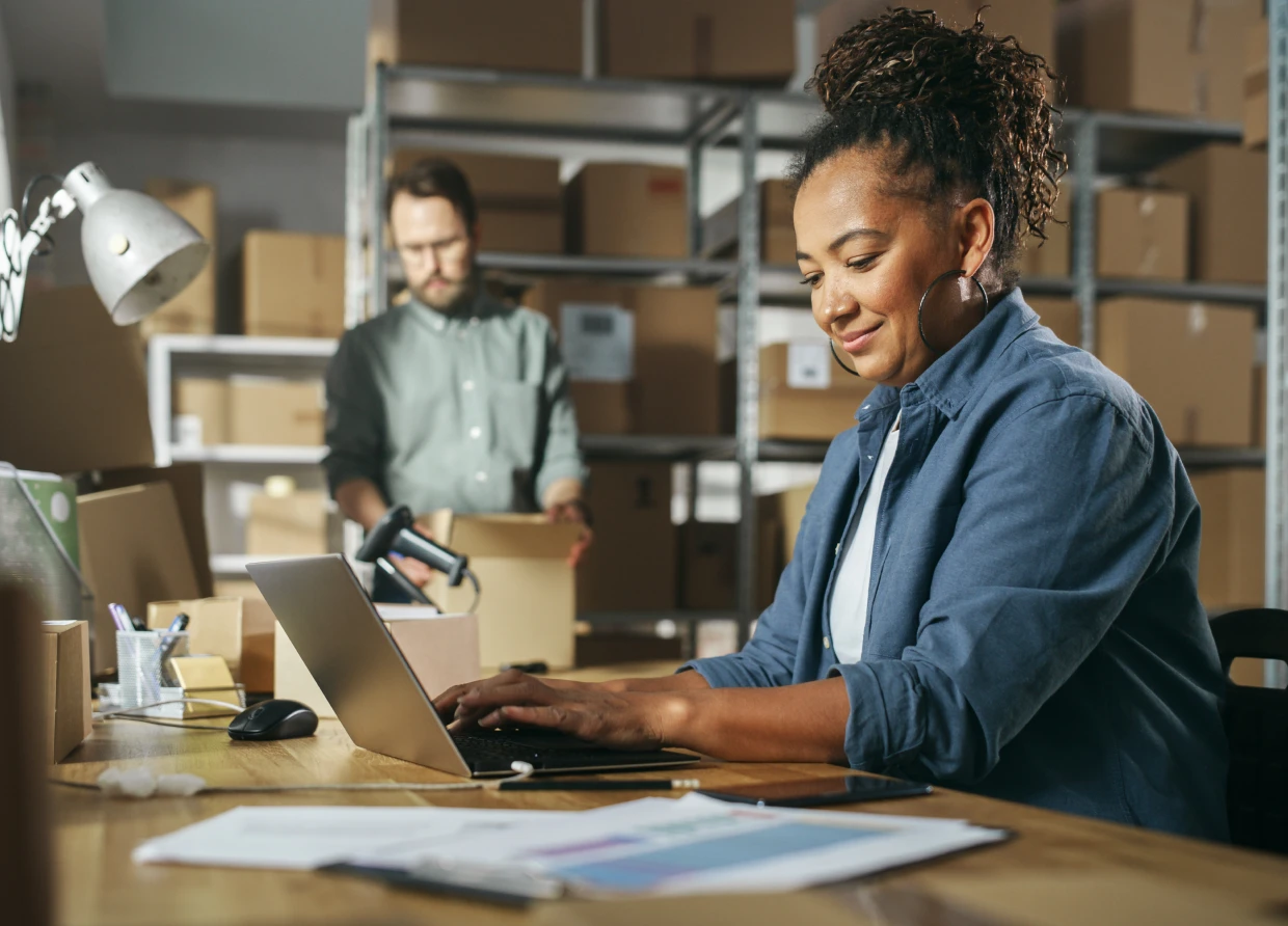 Busy warehouse with employees and boxes